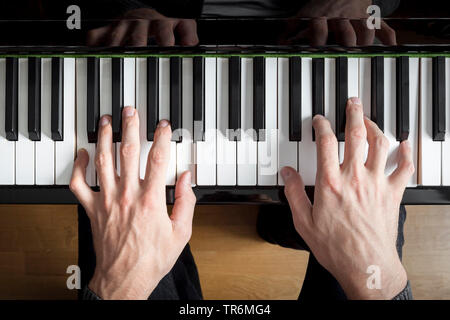 man playing piano, Germany Stock Photo