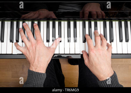 man playing piano, Germany Stock Photo