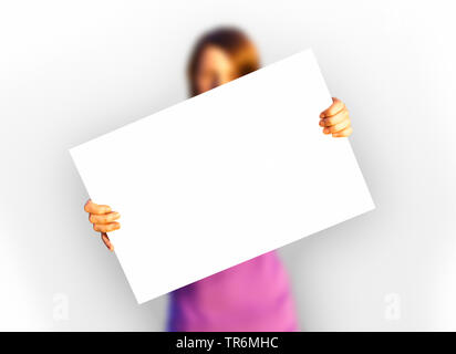 girl holding a white paper, Germany Stock Photo