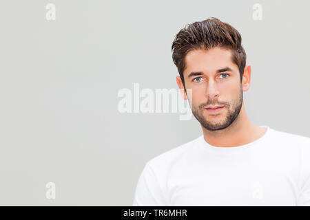 young attractive man in a white T-Shirt, portrait, Germany Stock Photo