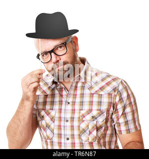 elderly man with chequered shirt and paper billycock hat, Germany