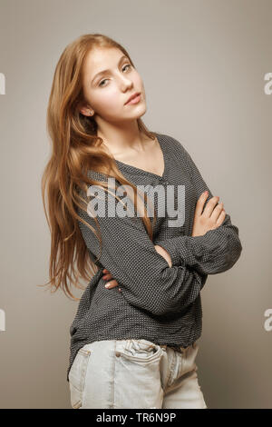 portrait of a young, very beauty girl with crossed arms, Germany Stock Photo