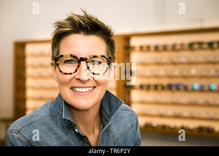 woman in a eyewear store, Germany Stock Photo