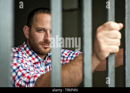 handsome man with checkered skirt arrested, Germany Stock Photo