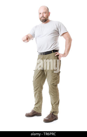 man with beard and frontal baldness pointing at something in front of white background, Germany Stock Photo