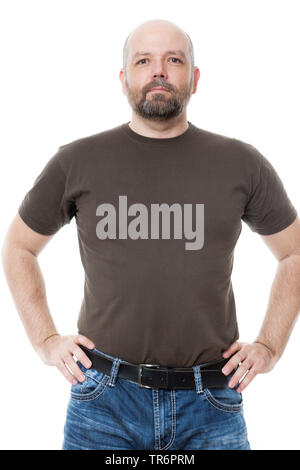 man with beard and bald head standing confidently with hands on hips, Germany Stock Photo