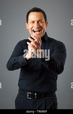 man in black is happy, Germany Stock Photo
