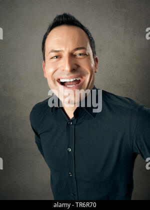 man in black is happy, Germany Stock Photo