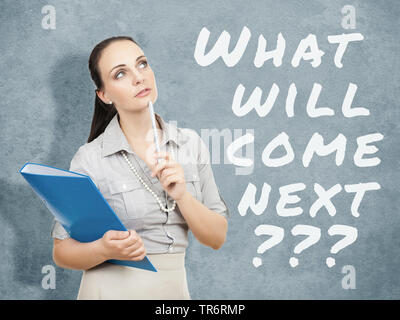business woman with a blue folder and the text what will come next ???, Germany Stock Photo