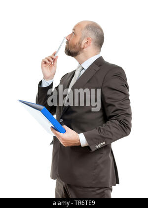 Middle-aged businessmann thinking about solutions and holding folder, Germany Stock Photo