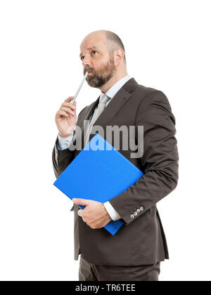 Middle-aged businessmann thinking about solutions and holding folder, Germany Stock Photo