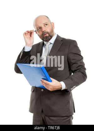 Middle-aged businessmann thinking about solutions and holding folder, Germany Stock Photo
