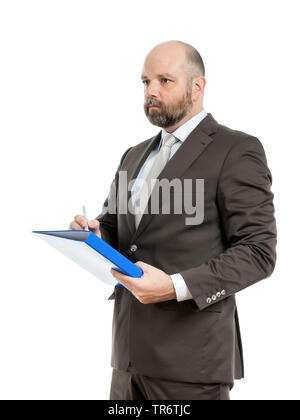 Middle-aged businessmann thinking about solutions and holding folder, Germany Stock Photo