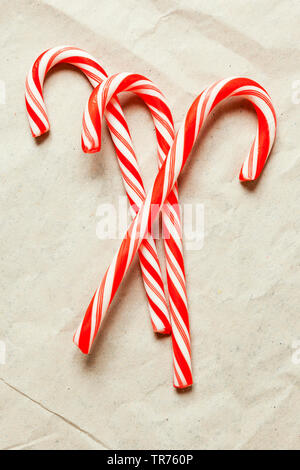 red and white candy canes on paper Stock Photo