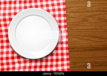 empty plate on a white-red chequered tablecloth, Germany, Bavaria Stock Photo