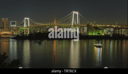 Iconic view from Odaiba on Reinbow Bridge and Tokyo Tower in illuminated City centre of japans capital at evening, October 2018 Stock Photo