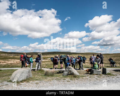 A group of teenagers undertaking the Duke of Ediburgh's Award Scheme assemble on the track near the Ribblehead via duct in the Yorkshire Dales Stock Photo