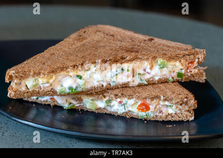 Superfood, vegan sandwich with whole grain bread, tomato, cucumber and cheese, healthy food concept, close up Stock Photo