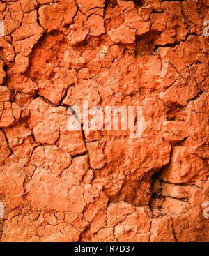 Red soil clay texture background pattern cracked wall dry Stock Photo