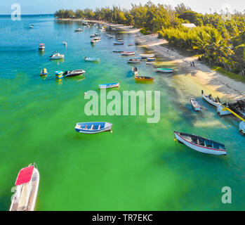 Beautiful turquoise ocean water with wooden boats on the water. Top view aerial photo. Stock Photo