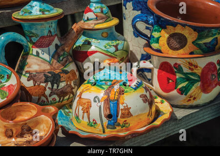 Colorful handmade porcelain pots and bowls, typical of the region, at Serra da Estrela ridge. The highest mountain range in continental Portugal. Stock Photo