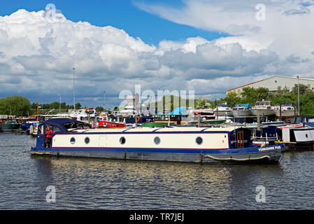 Woman and narrowboat, Yorkshire Pud, and boats moored in the marina, Goole, East Yorkshire, England UK Stock Photo