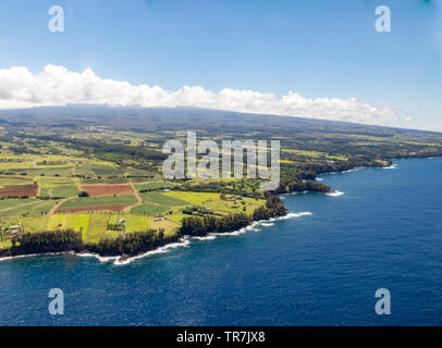 View along the Hawaiian shore from the Big Island spectacular helicopter tour Stock Photo