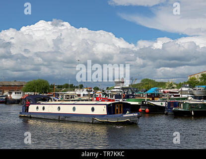 Woman and narrowboat, Yorkshire Pud, and boats moored in the marina, Goole, East Yorkshire, England UK Stock Photo