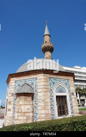 Izmir, Turkey - April 22, 2012: Old small mosque (Konak Camii) on the central Konak square in Izmir, Turkey. Stock Photo