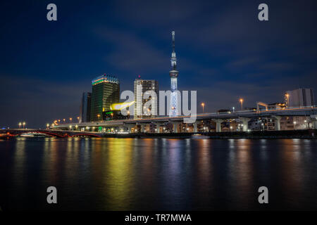 View of the Skytree Tower with the reflection in the river at night. Stock Photo