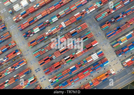 Container ship in export and import business logistics and transportation. Cargo and container box shipping to harbor by crane. Water transport Intern