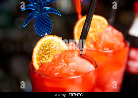Fruit sorbet in a glass on a blurred background. Stock Photo