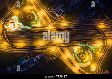 Aerial view of highway junctions. Bridge roads shape number 8 or infinity sign in structure of architecture concept. Top view. Urban city, Bangkok at Stock Photo