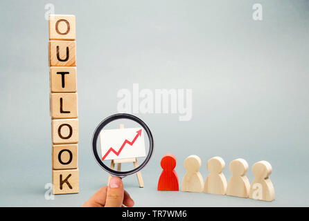 Wooden blocks with the word Outlook, business schedule and a team with a leader. Successful forecast and successful business. Concept perspectives in Stock Photo