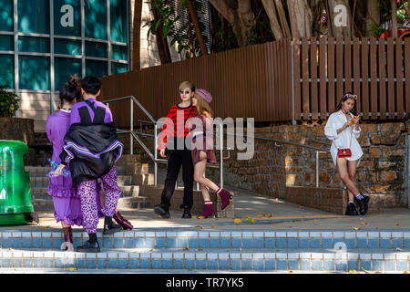 A young fashionable Hong Kong Chinese couple and friend Stock Photo ...