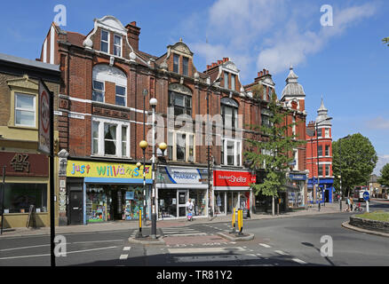Small, idependent shops on Lordship Lane in East Dulwich, south London, UK. Shows junction with Grove Vale. Stock Photo