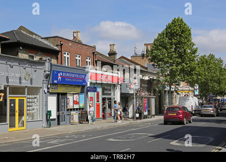 The newly refurbished East Dulwich Post Office on Lordship Lane, south London. Shows small shops on either side in this busy local high street. Stock Photo