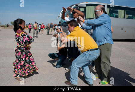 A Tarahumara indian girl being photographed by toursuts in a Menonite community, Ciudad Cuahutemoc, Chihuahua, Mexico. Aromas y Sabores with Chef Patr Stock Photo