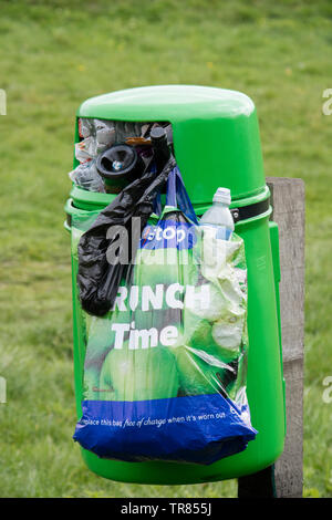 Overflowing litter bins in the countryside, England UK Stock Photo