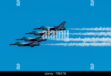 Wantagh, New York, USA - 24 May 2019: The United States Air Force Thunderbirds performing the echelon pass in review on Memorial Day Weekend. Stock Photo