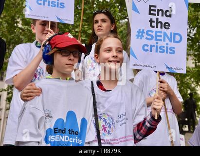 Hundreds of parents, carers, children and young people with disabilities demonstrated in Parliament Square to highlight a funding crisis in Special Needs and Disabilities (SEND). Parliament Square, London. UK Stock Photo