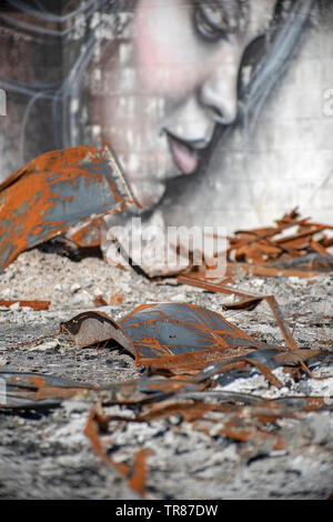 Graffiti artist Shane Grammer paints portraits among the ashes from Paradise CA Camp Fire Stock Photo