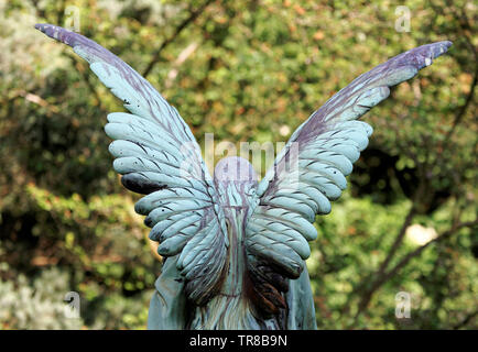 rear view of angel wings at a cemetery in cologne against blurred background Stock Photo