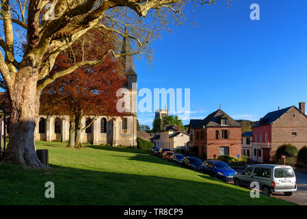 The Église Saint-André by a park in Le Bec-Hellouin, Normandy, France on a sunny spring day Stock Photo