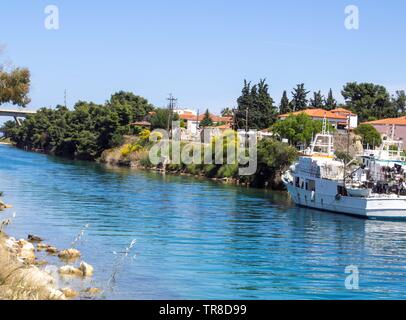 A fishing boat tied up near the small harbour on the Nea Potidea Canal, Halkidiki, Greece, Stock Photo