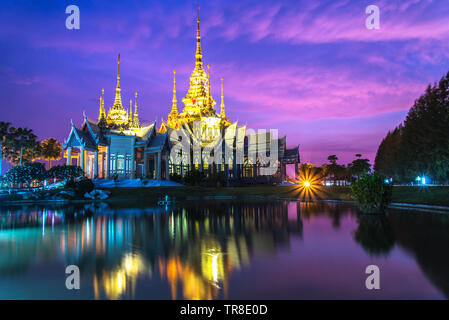 beautiful temple thailand dramatic colorful sky twilight sunset shadow on water reflection with light - Landmark Nakhon Ratchasima province temple at Stock Photo