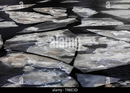 Sea ice in a fjord containing the outport of Grey River, Newfoundland, Canada Stock Photo