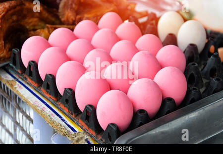 Pink eggs in box for sale in the market asian food traditional preserved duck eggs Stock Photo