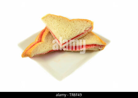 Sandwich homemade with strawberry jam in bread for breakfast isolated on white background Stock Photo