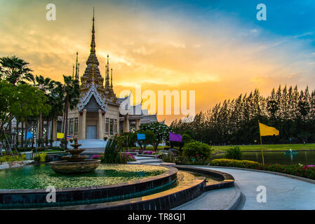 Beautiful temple thailand dramatic colorful sky twilight sunset / Landmark Nakhon Ratchasima province temple at Wat None Kum in Thailand with yellow s Stock Photo